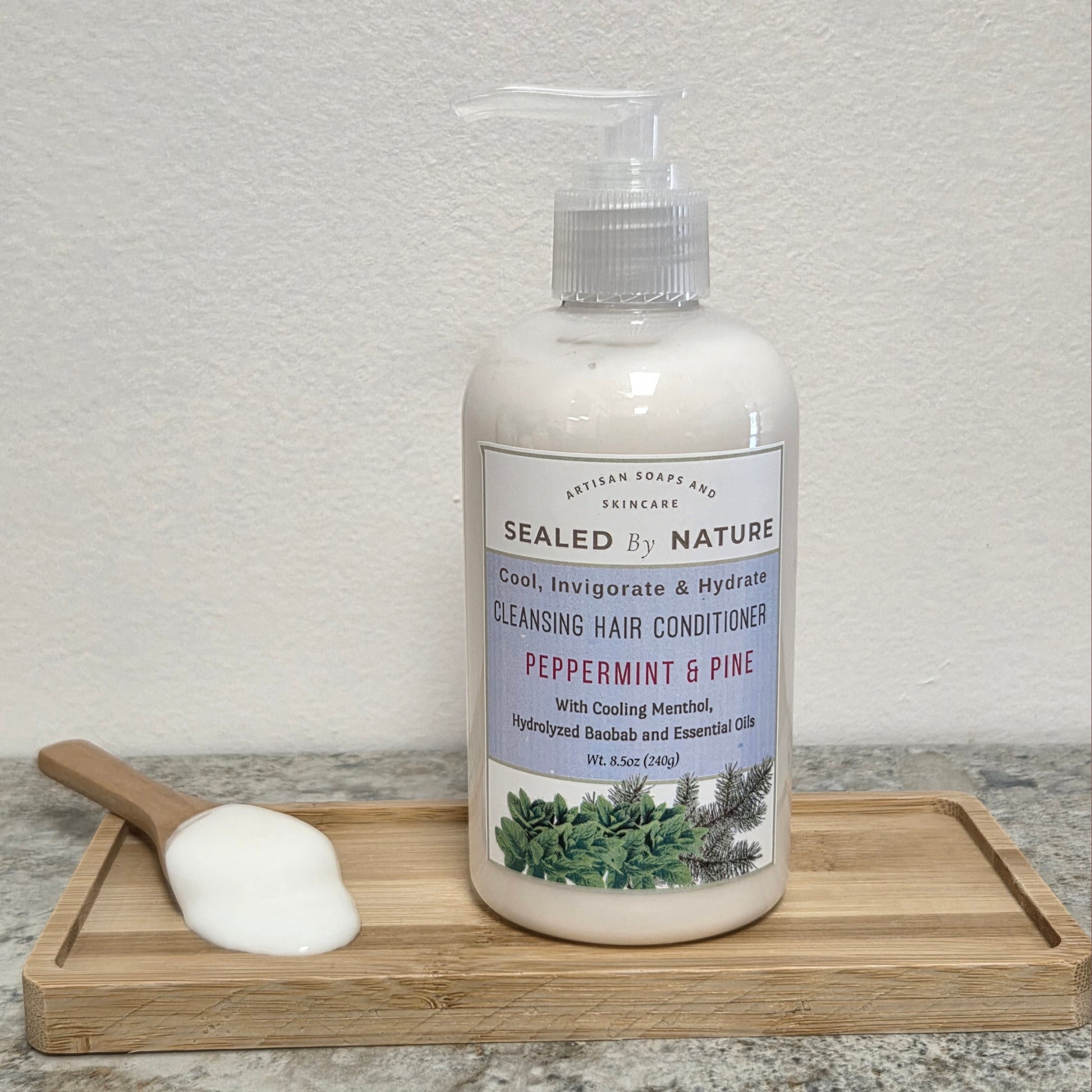 Bottle of Peppermint Pine Hair Conditioner with pump top, designed to hydrate hair and refresh the scalp with peppermint, pine, and menthol.