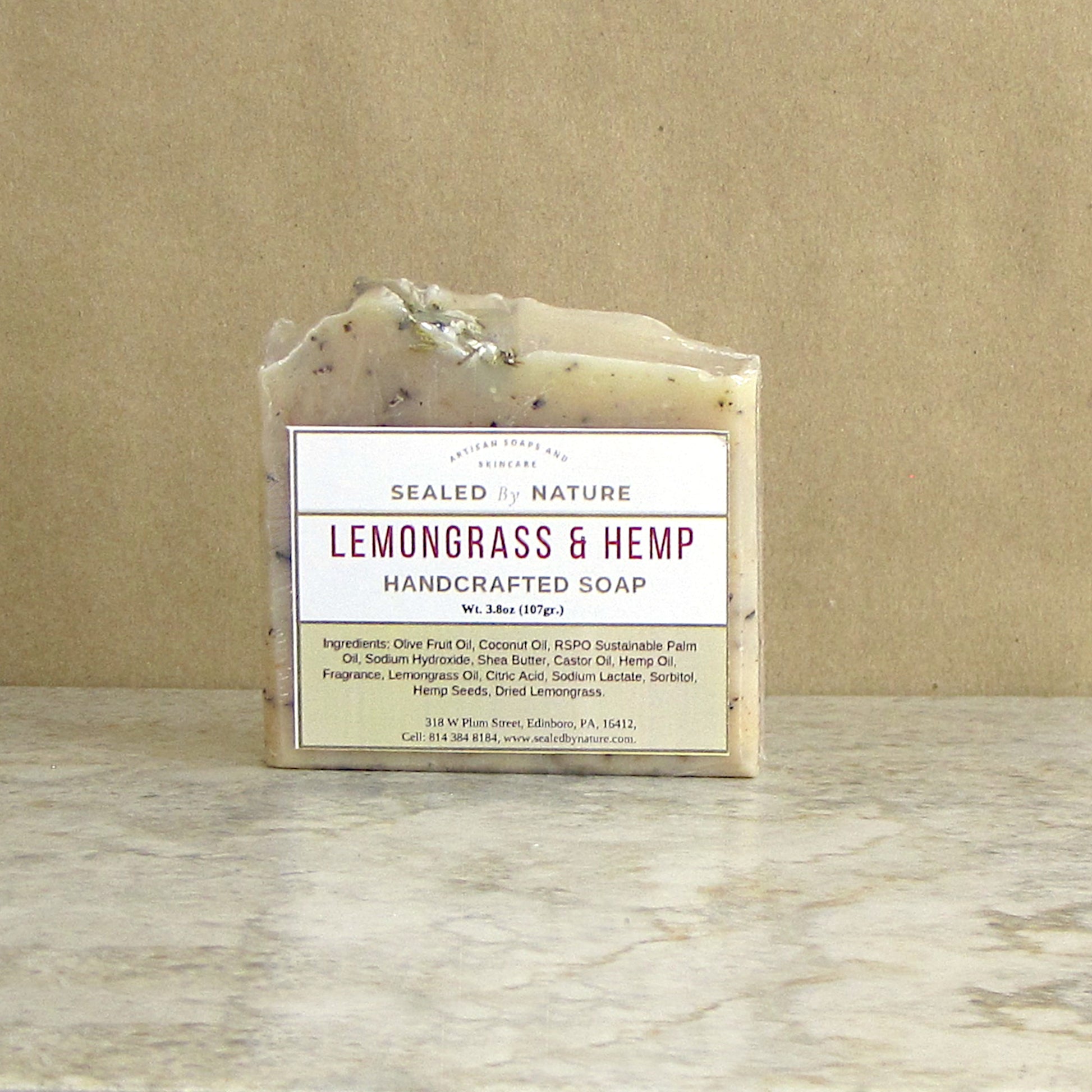 Handcrafted soap bar labeled 'Lemongrass & Hemp' on a neutral background