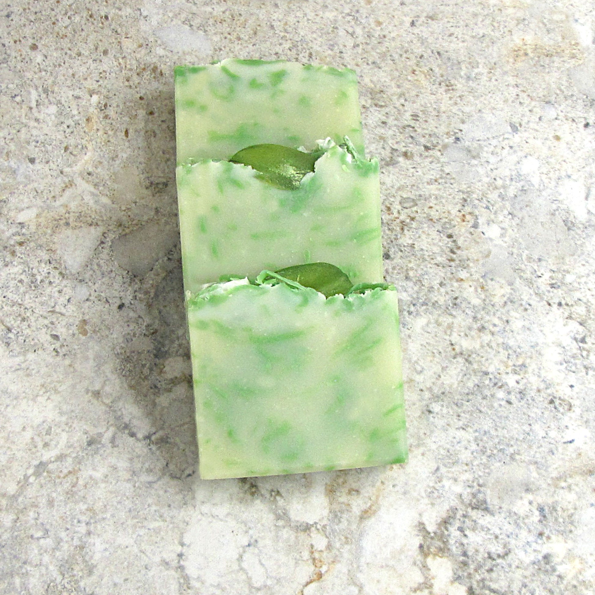 Three slices of Mint Mojito soap bars placed on the table.