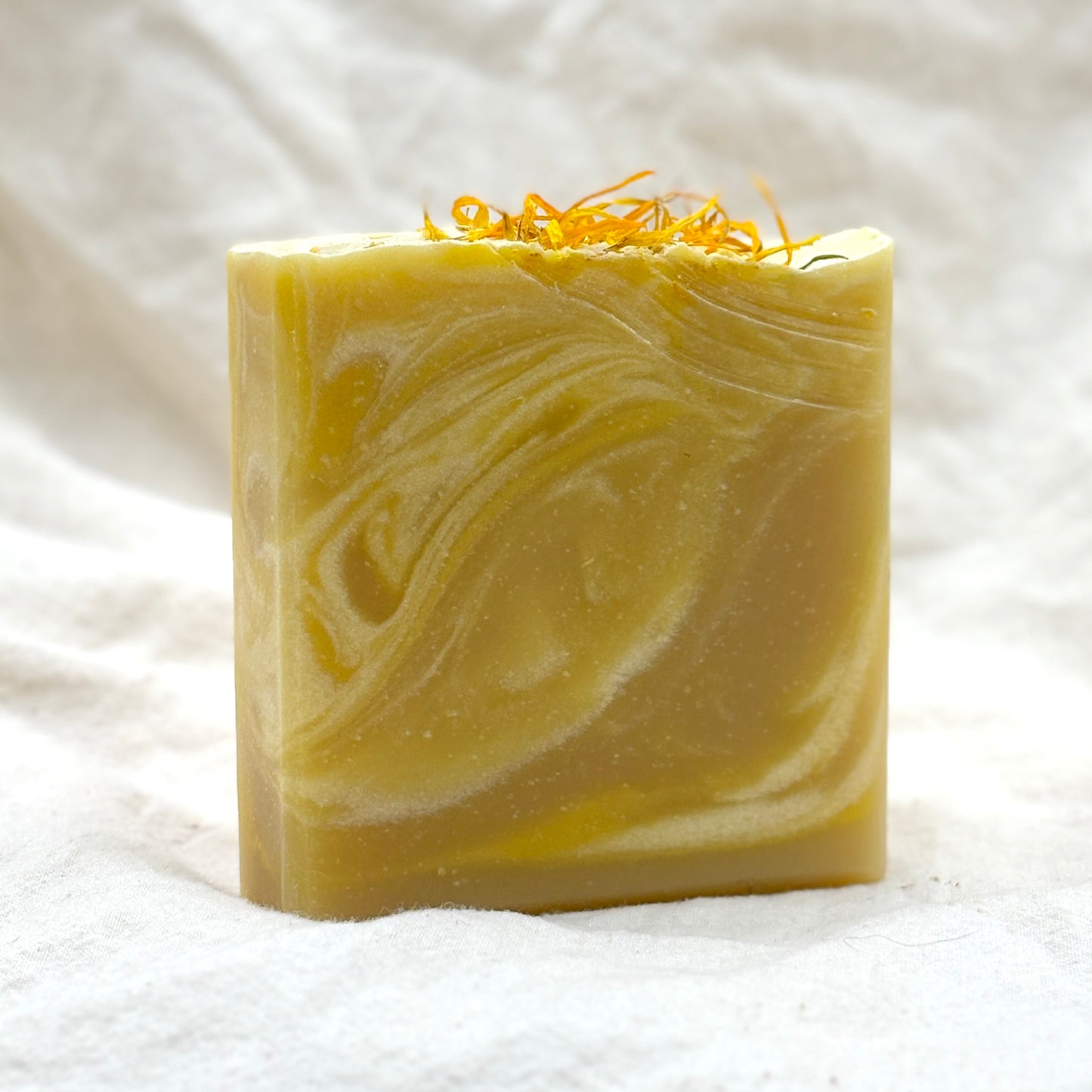 Bar of soap with a swirled pattern on a white background