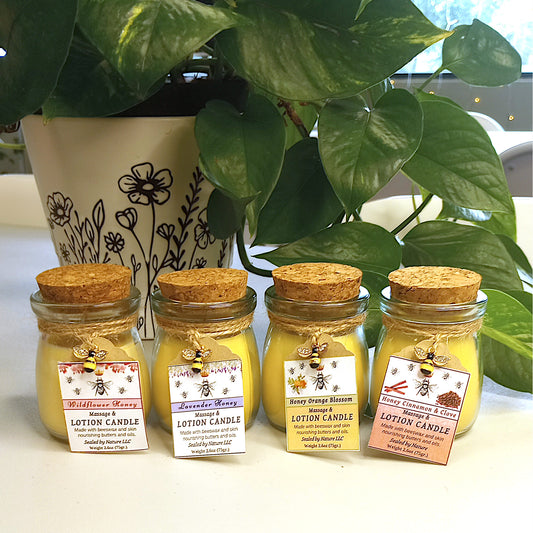 Cocoa Butter lotion candles in small jars with cork lids. Description of four scents on the labels with a small bee charm tied to the jar.