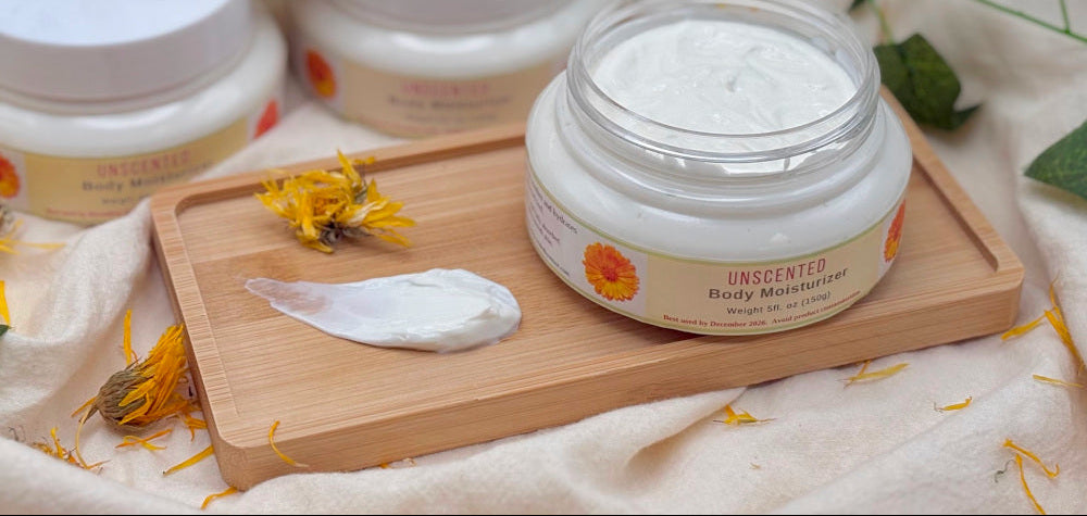 Body moisturizer jars on a wooden tray with natural elements