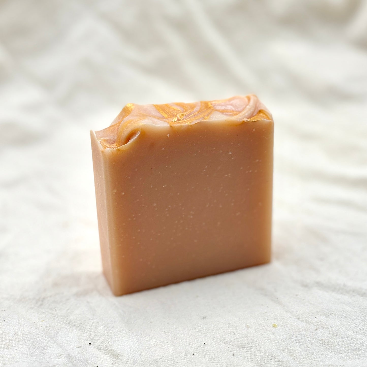 Bar of soap on a textured white background