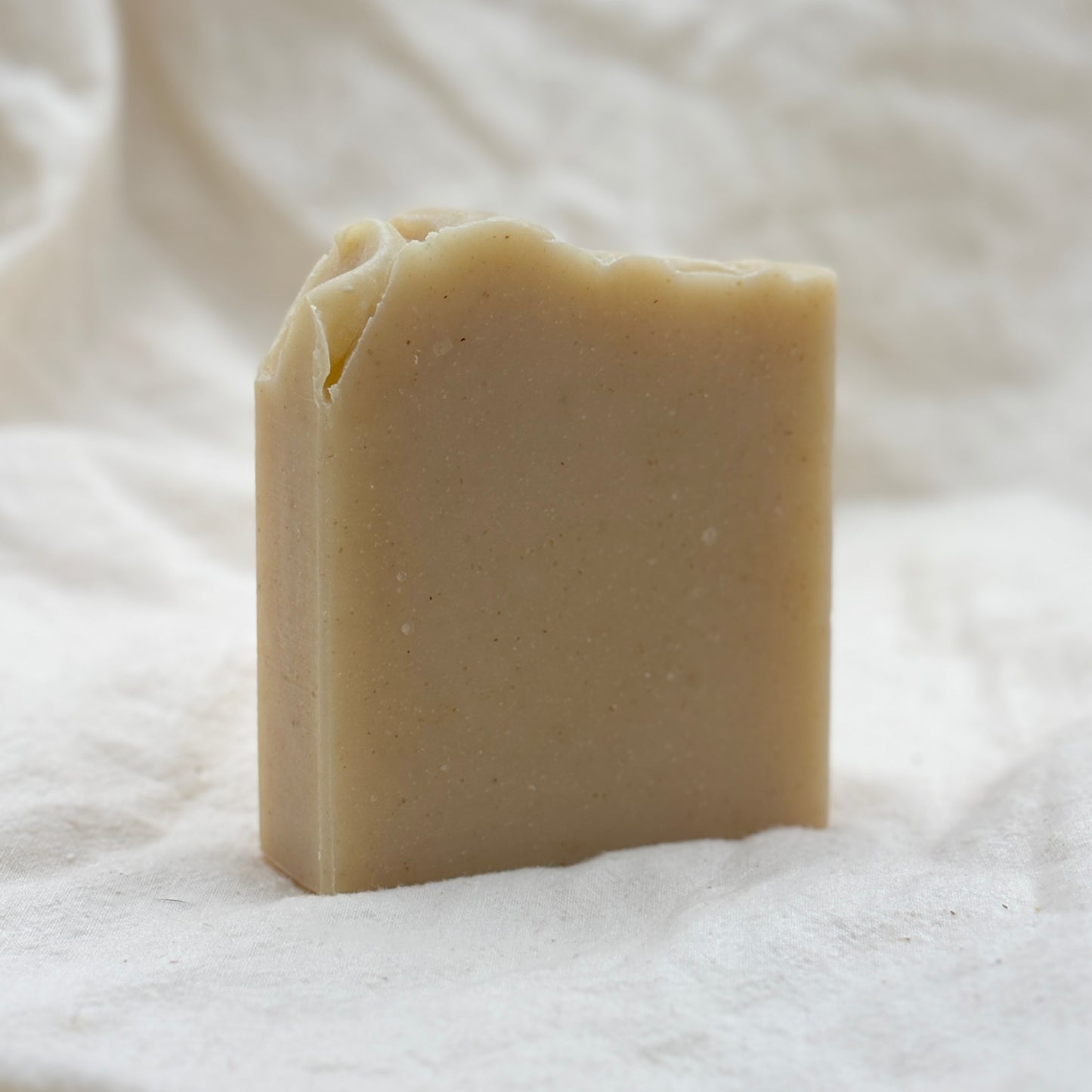 Bar of soap on a textured white background