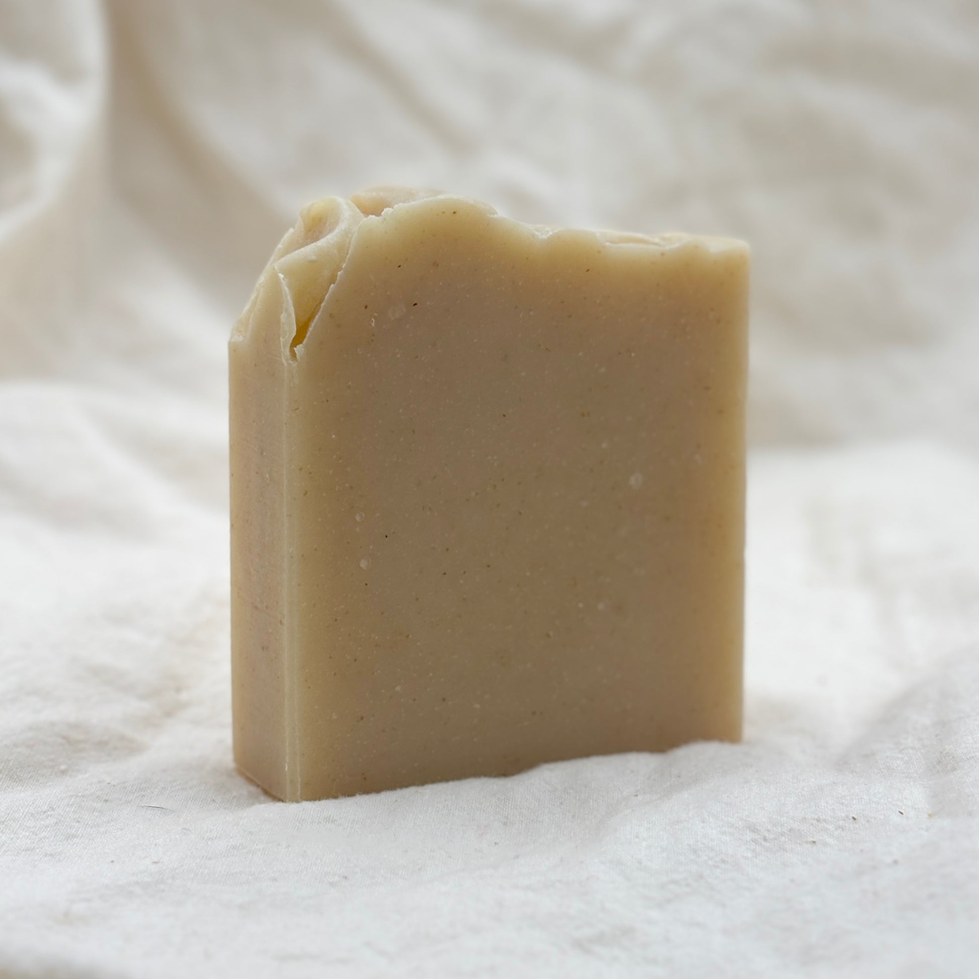 Bar of soap on a textured white background