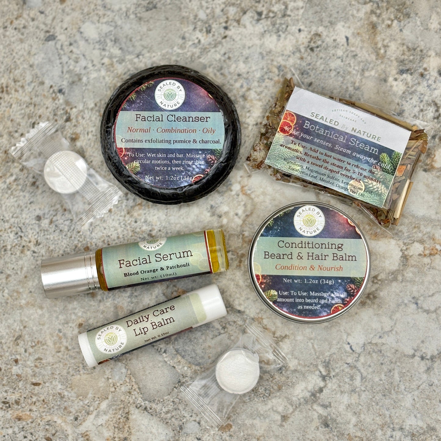 Collection of natural skincare products on a stone surface