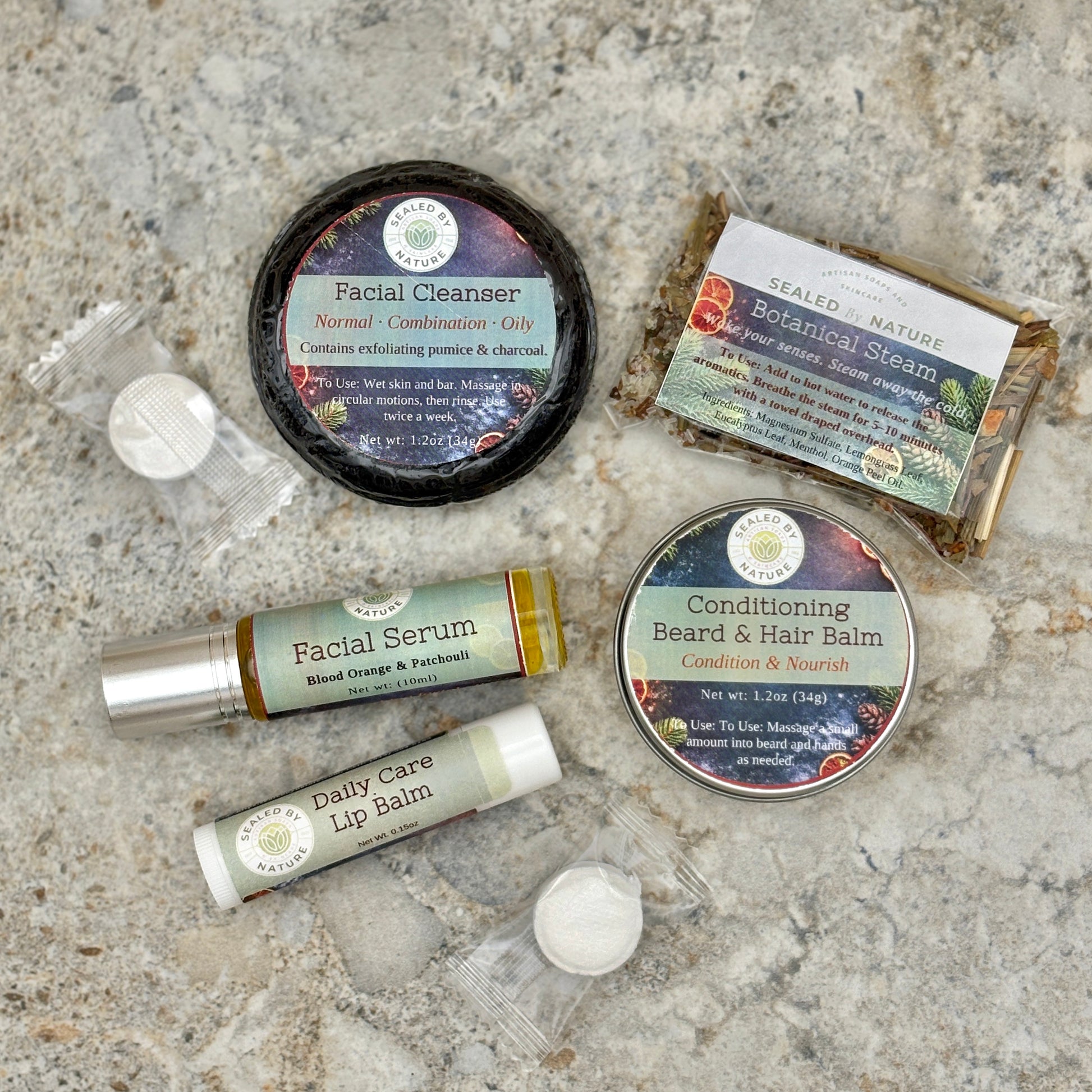 Collection of natural skincare products on a stone surface