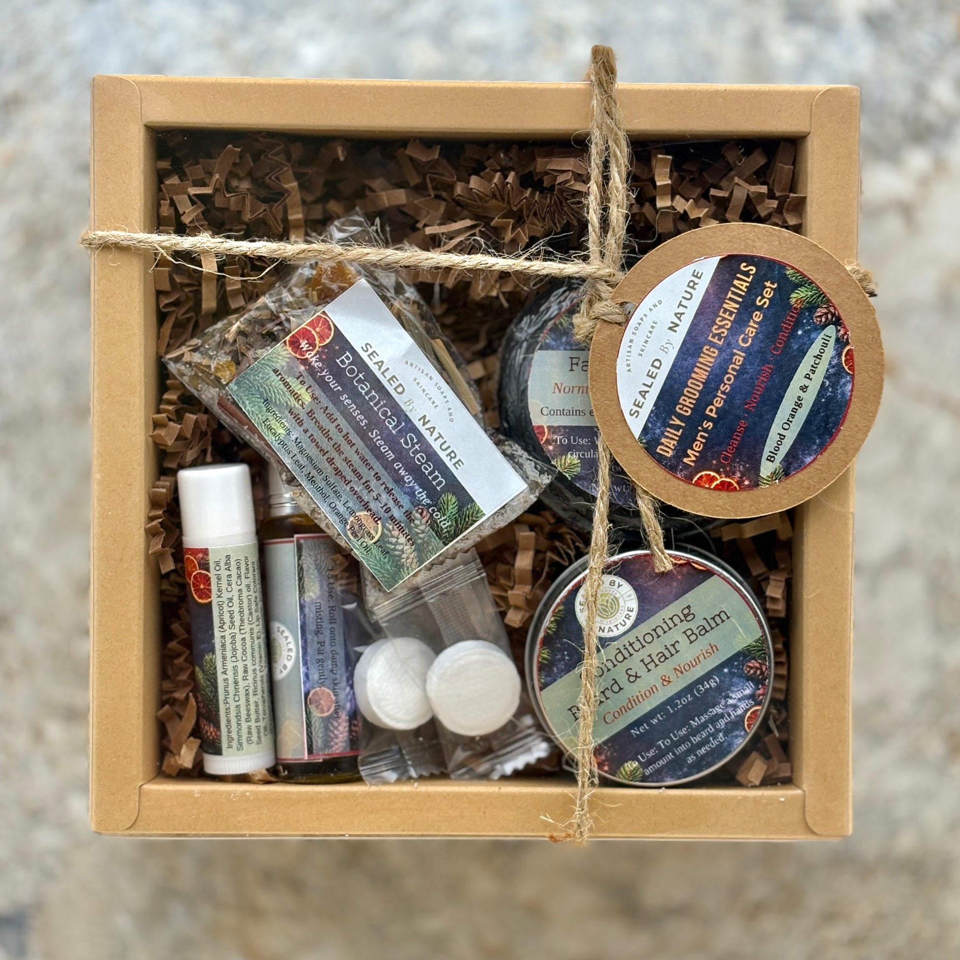 Box of Daily Grooming natural skincare products with labels on a neutral background