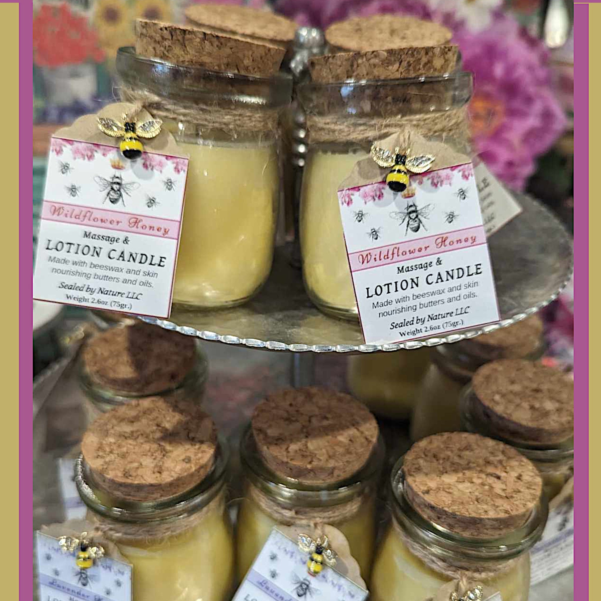 Lotion Candles stacked on a two tier metal tray.