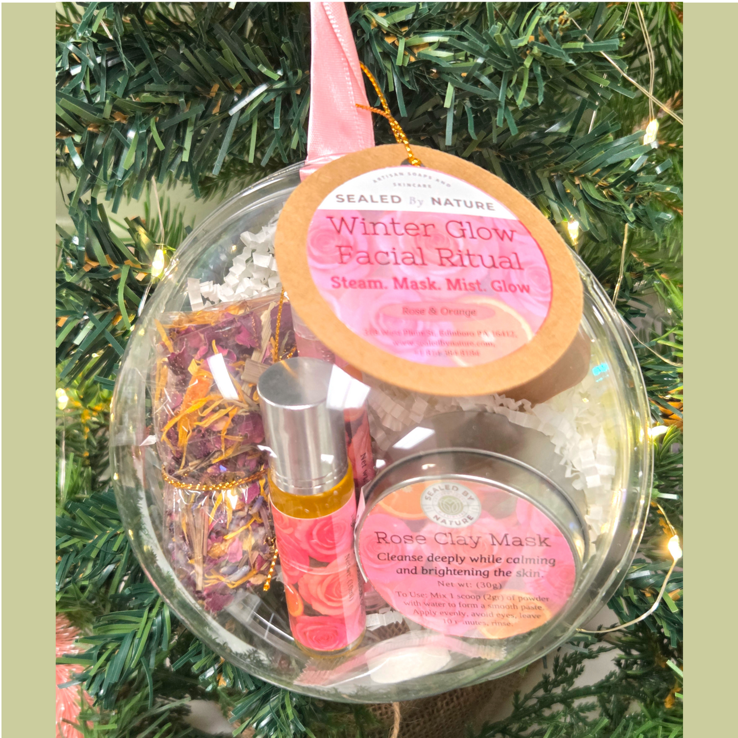 Facial care kit with 'Winter Glow' label on a Christmas tree background.