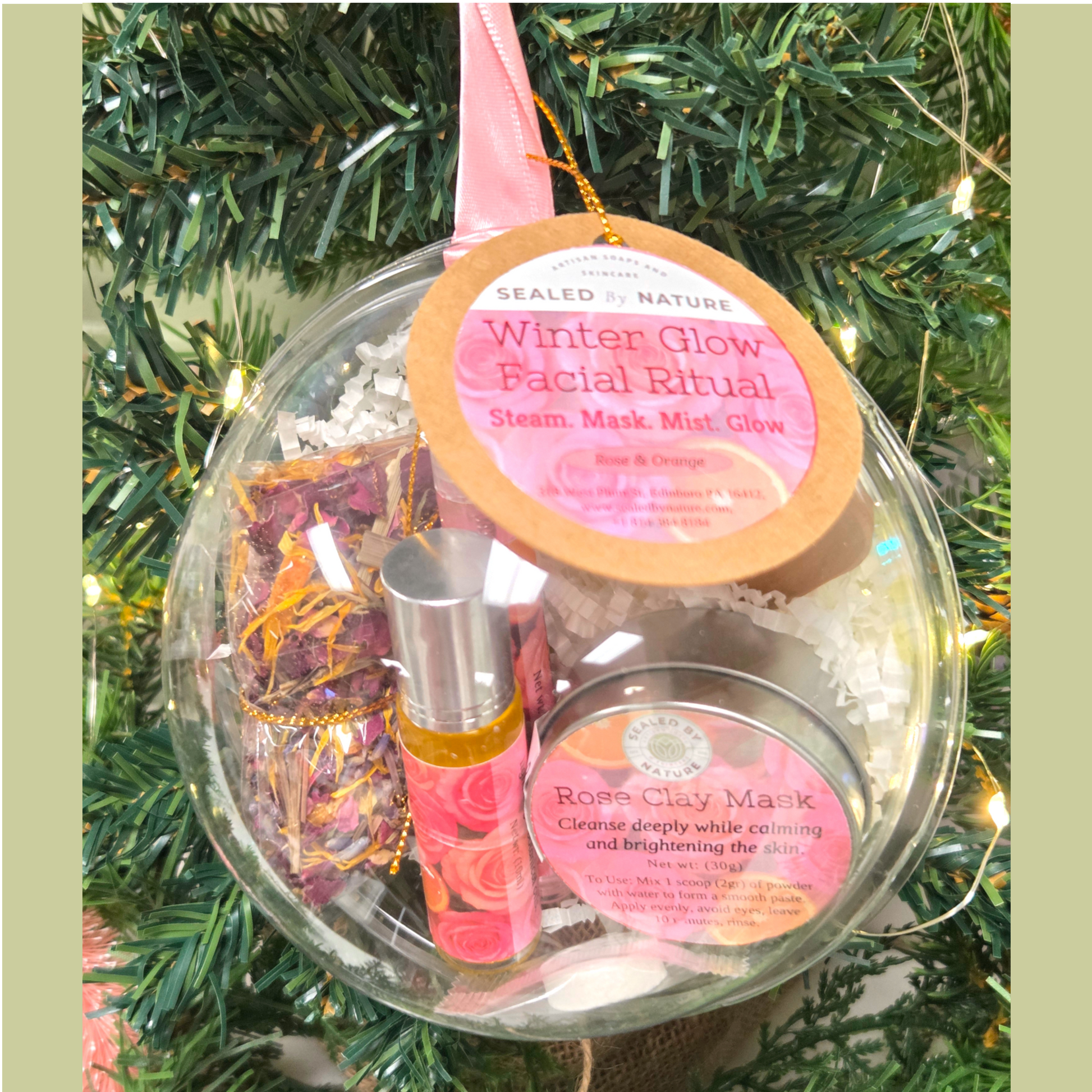 Facial care kit with 'Winter Glow' label on a Christmas tree background.